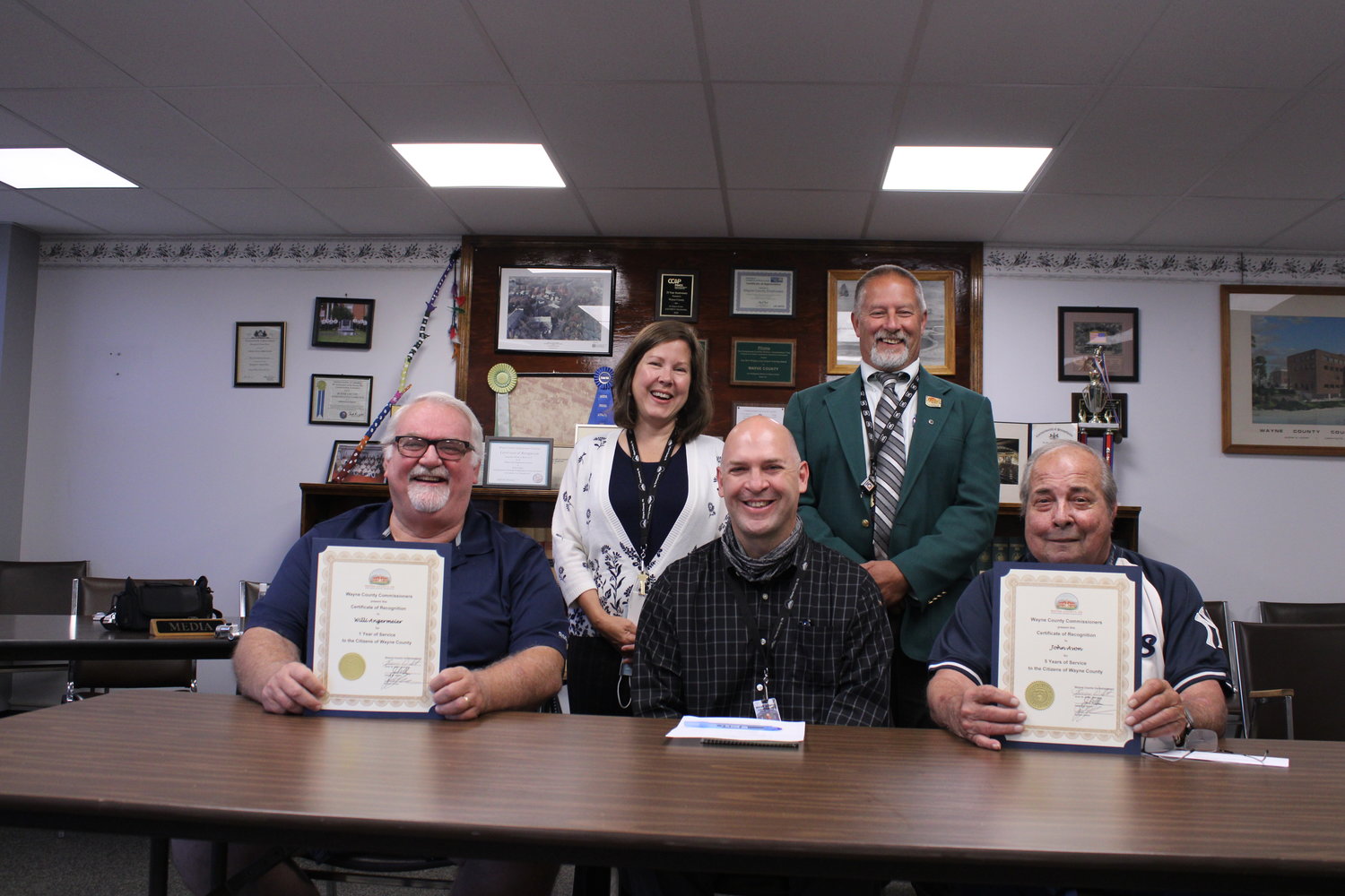 Willi Angermeier, front left, Carl Albright, front middle, Joh Avon, front right. Commissioner Jocelyn Cramer, back left, Commissioner Brian Smith, back right.